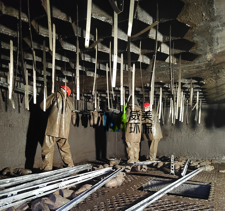 On-site Replacement of Titanium Electrode Wires and Anti-sway Frames of Wet Electrostatic Demister for Flue Gas Treatment in a Brick Factory; Dust and Dirt Inside Are Clearly Visible